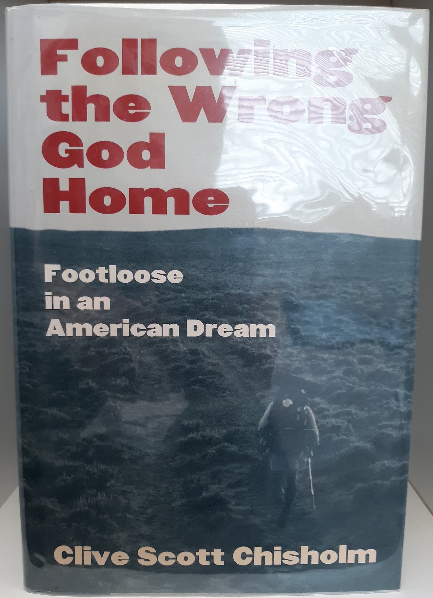 Following the Wrong God Home: Footloose in an American Dream (Signed) (2003) ~ by Clive Scott Chisholm