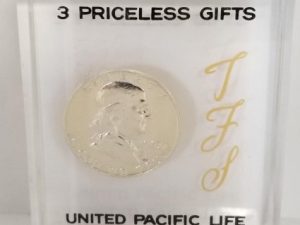 1963 D — Franklin Silver Half Dollar — United Pacific Life (Laminated)