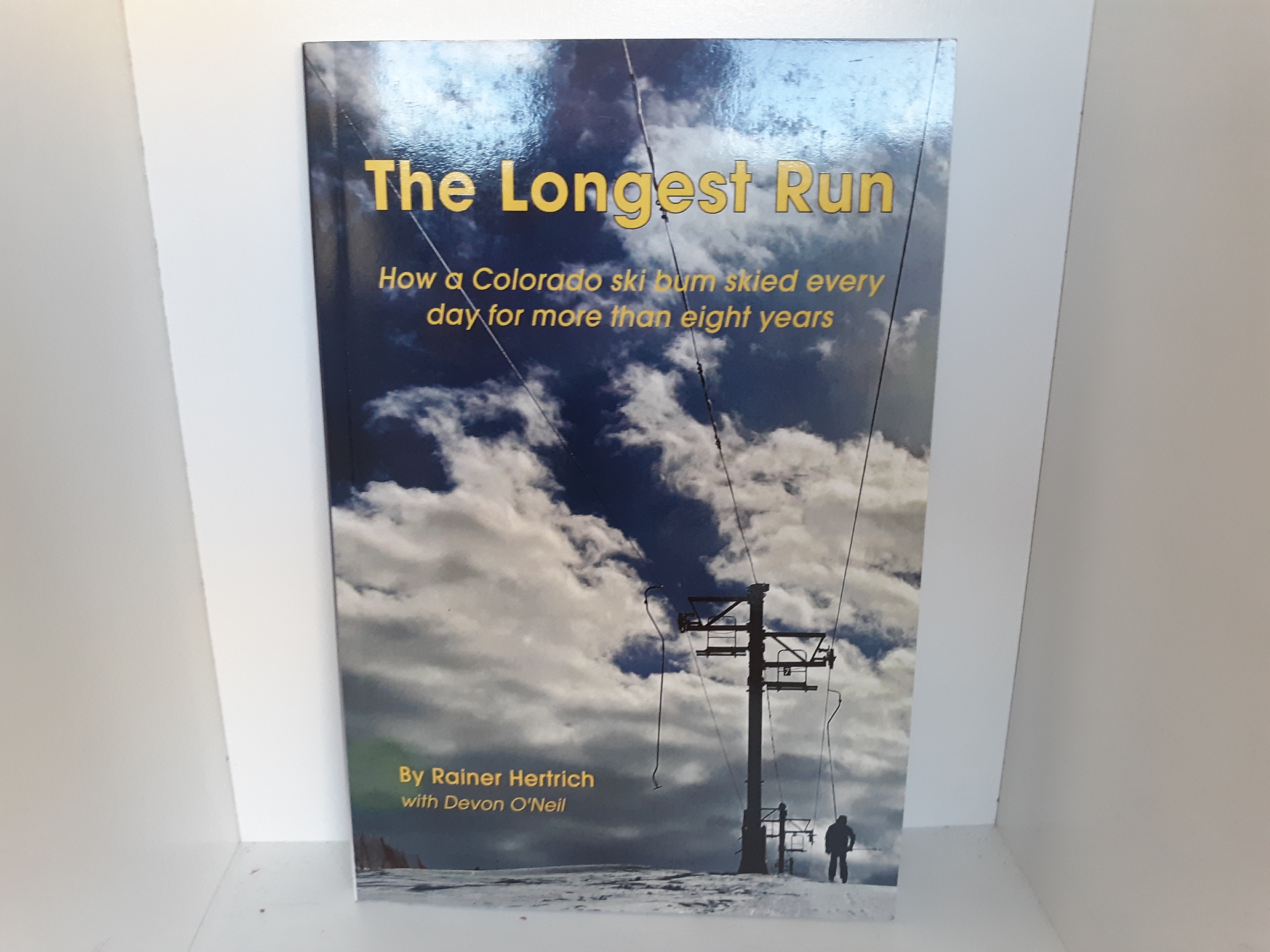 The Longest Run: How a Colorado Ski Bun Skied Every Day for More than Eight Years (Signed) (2015) ~ by Rainer Hertrich, and Devon O’Neil