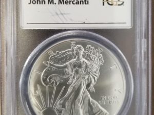 2014 — American Silver Eagle — PCGS MS70 — First Strike — Signed by John Mercanti — Silver Dollar in Plastic Case