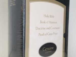 New in Plastic: Black Genuine Leather Quadruple Combination — New in Plastic — 9.5″ Tall