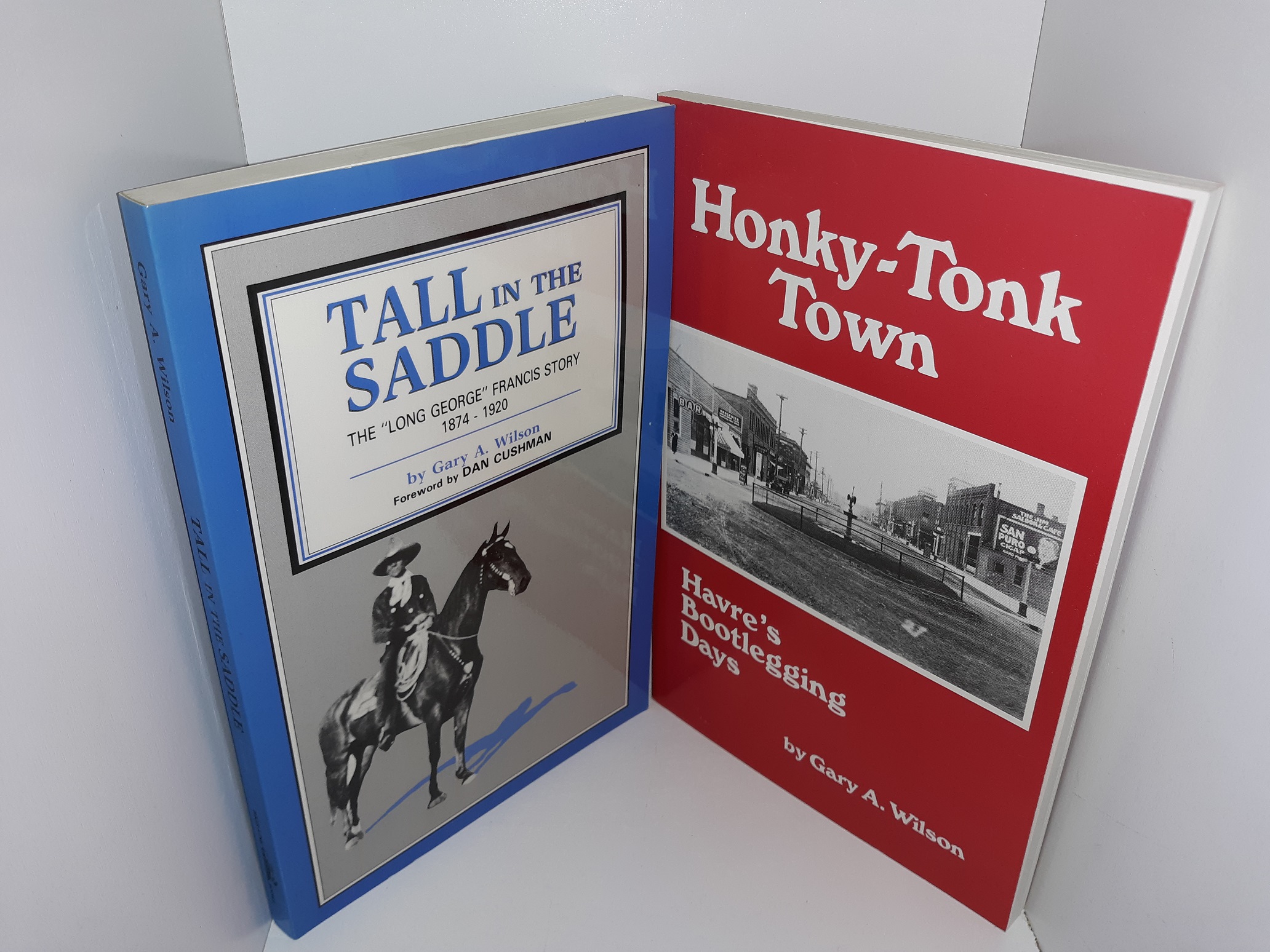 2 Signed Western Americana Books by Gary A. Wilson: Tall in the Saddle: The “Long George” Francis Story, 1874 – 1920 / Honky-Tonk Town: Havre’s Bootlegging Days