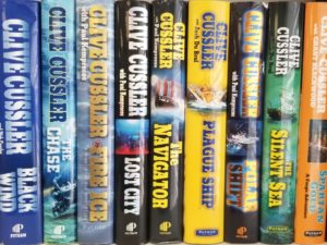 Collection of 11 Hardbound Books — by Author, Clive Cussler — Arctic Drift, Black Wind, Chase, Fire & Ice, Lost City, Navigator, Plague Ship, Polar Shift, Silent Sea, Spartan Gold, Valhalla Rising