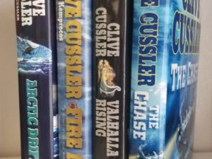 Collection of 4 Hardbound Novels by Clive Cussler — The Chase / Valhalla Rising / Fire & Ice / Arctic Drift