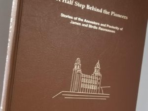 1999 — A Half Step Behind the Pioneers — Stories of the Ancestors & Posterity of James & Birdie Rasmussen — Brown Bonded Leather Binding