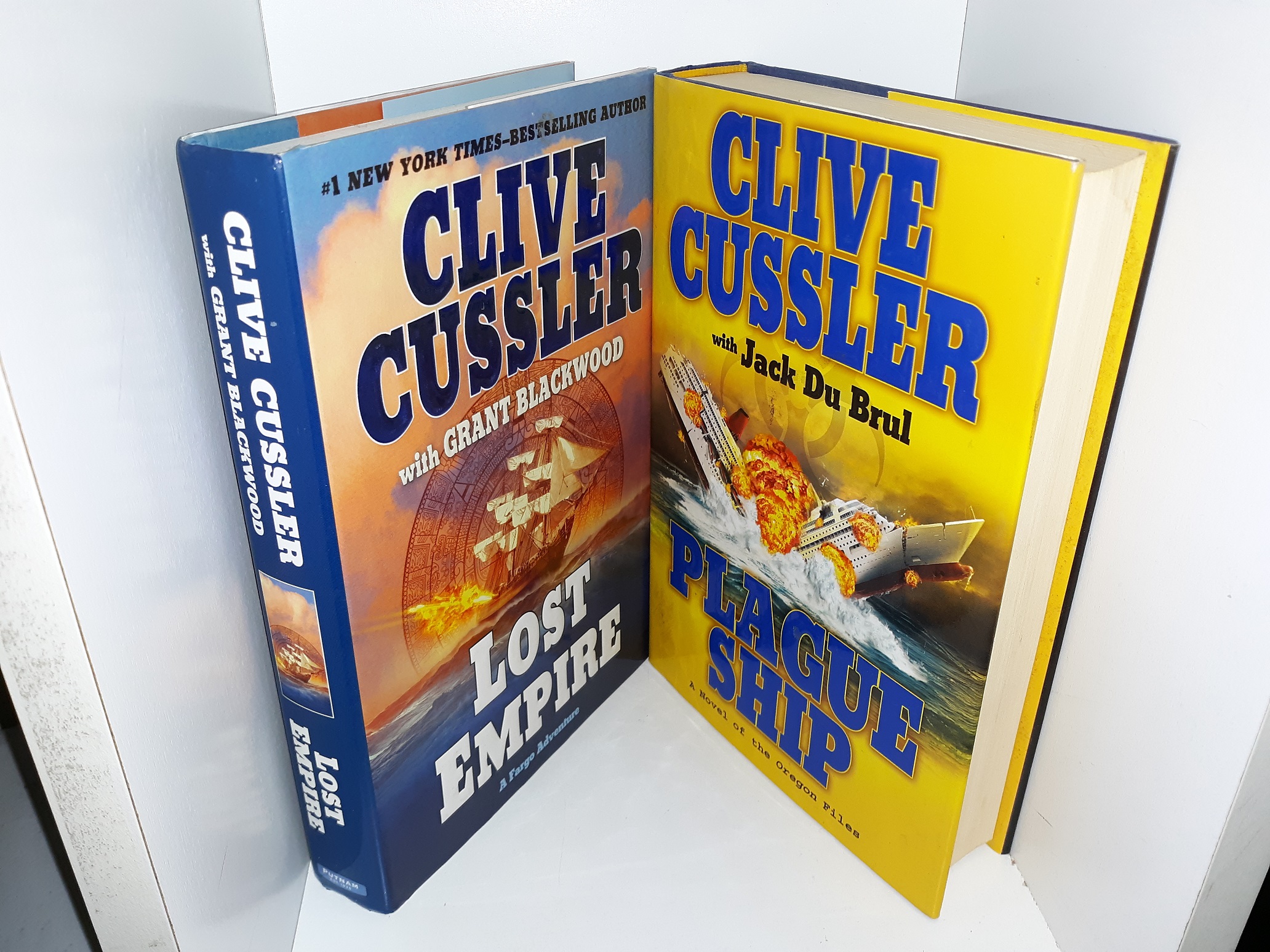2 Novels by Clive Cussler: Plague Ship / Lost Empire (See Details)