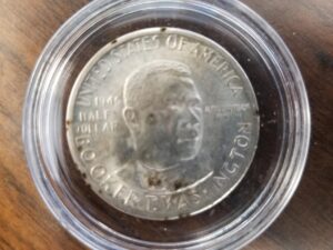 1946D-S  Silver Half Dollar — Booker T. Washington — “From Slave Cabin to Hall of Fame” — Booker T. Washington Birthplace Memorial