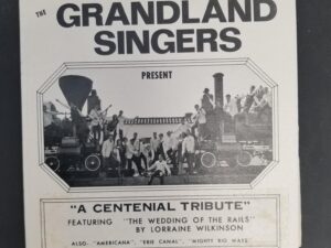 The Grandlands Singers — “A Centenial Tribute” — Vinyl Record in Original Sleeve — Featuring “The Wedding of the Rails” by Lorraine Wilkinson — Signed by Wilkinson on Sleeve