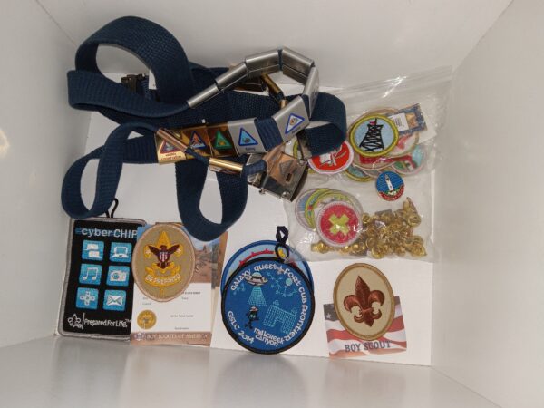 Box Containing a Scouting Belt, Badges, and Various Pins