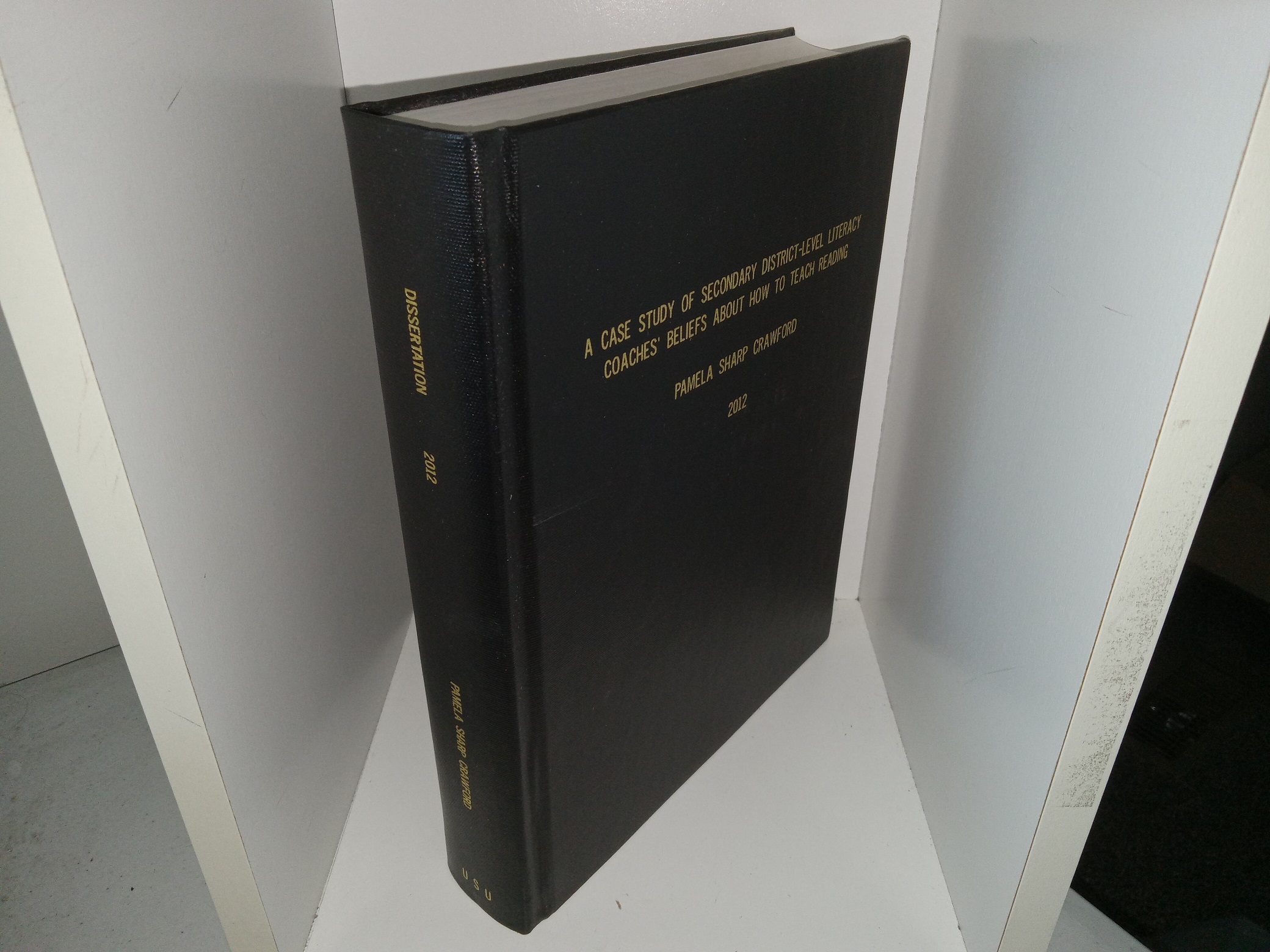 A Case Study of Secondary District-Level Literacy Coaches’ Beliefs About How To Teach Reading (Signed & Inscribed) (2012) ~ by Pamela Sharp Crawford