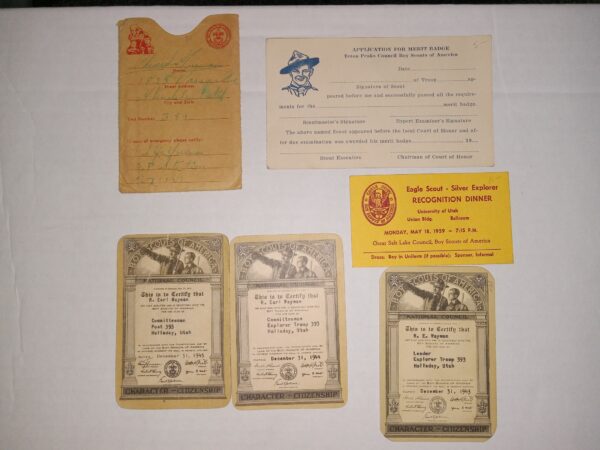 6 Boy Scouting Items Including a Merit Badge Application, 3 Certification Cards, An Invitation for an Eagle Scout – Silver Explorer Recognition Dinner, and an Emergency Contact Form/Pouch