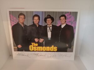 Signed Photograph of 4 of the Osmond Brothers w/ Flyer