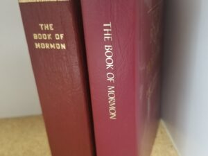 2 Small Red Softcover Editions of the Book of Mormon — 1982  & 2003