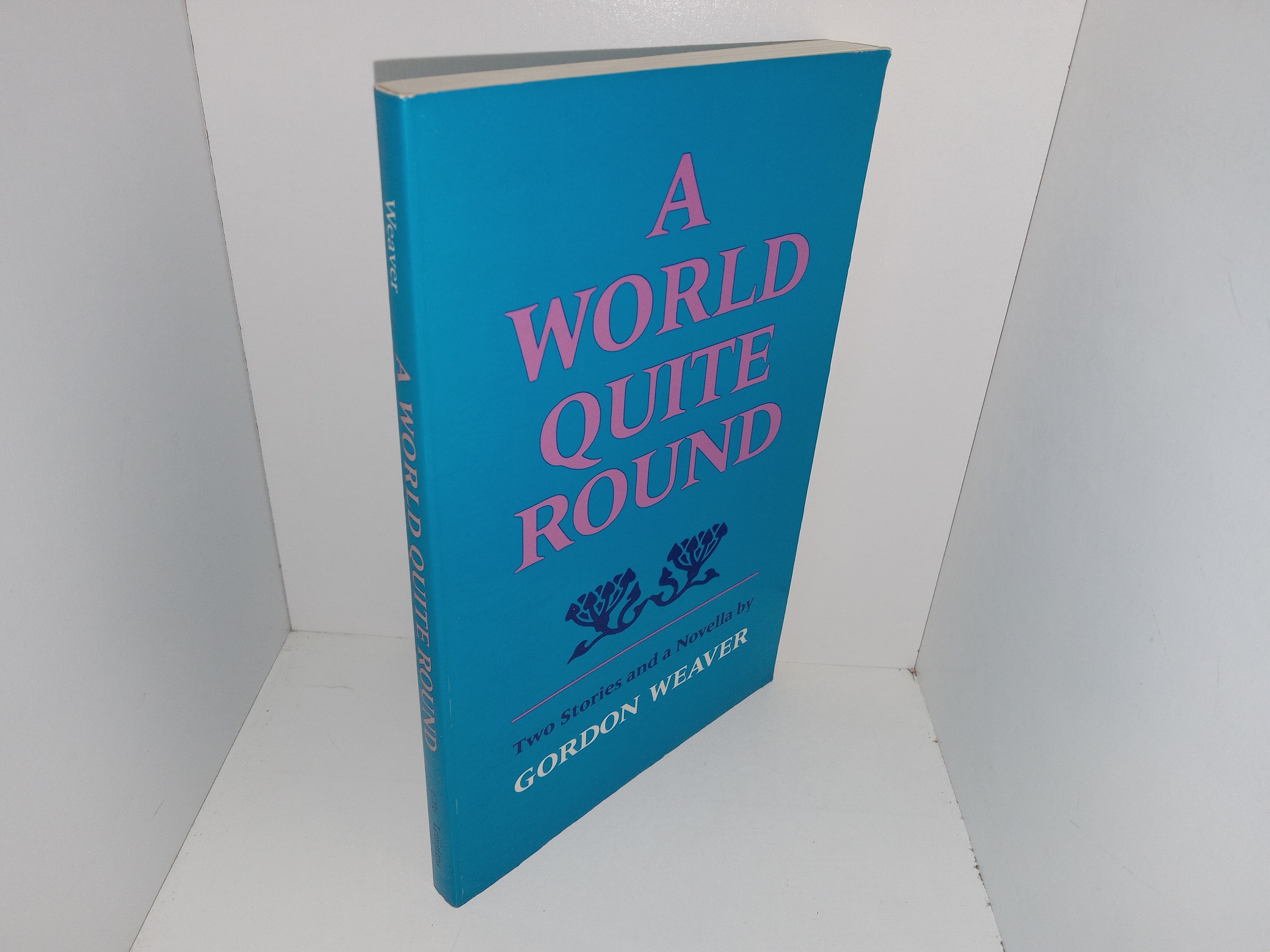 A World Quite Round: Two Stories and a Novella (Signed and Inscribed by the Author (But Only the First Name)) (1986) ~ by Gordon Weaver