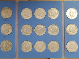 Eisenhower Dollars Collection Starting 1971 — Book Containing 24 Coins