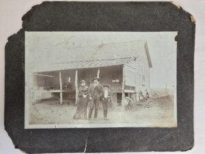 Old Photograph — Family in Front of Old House