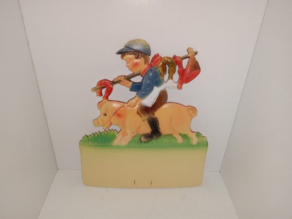 Unique Cardboard Scene of Child wielding meat on a stick while Riding a Pig