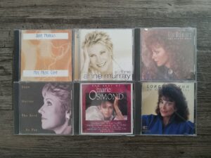 6 Misc. Music CDs by Artists Like Anne Murray, Reba McEntire, Marie Osmond, and Loretta Lynn
