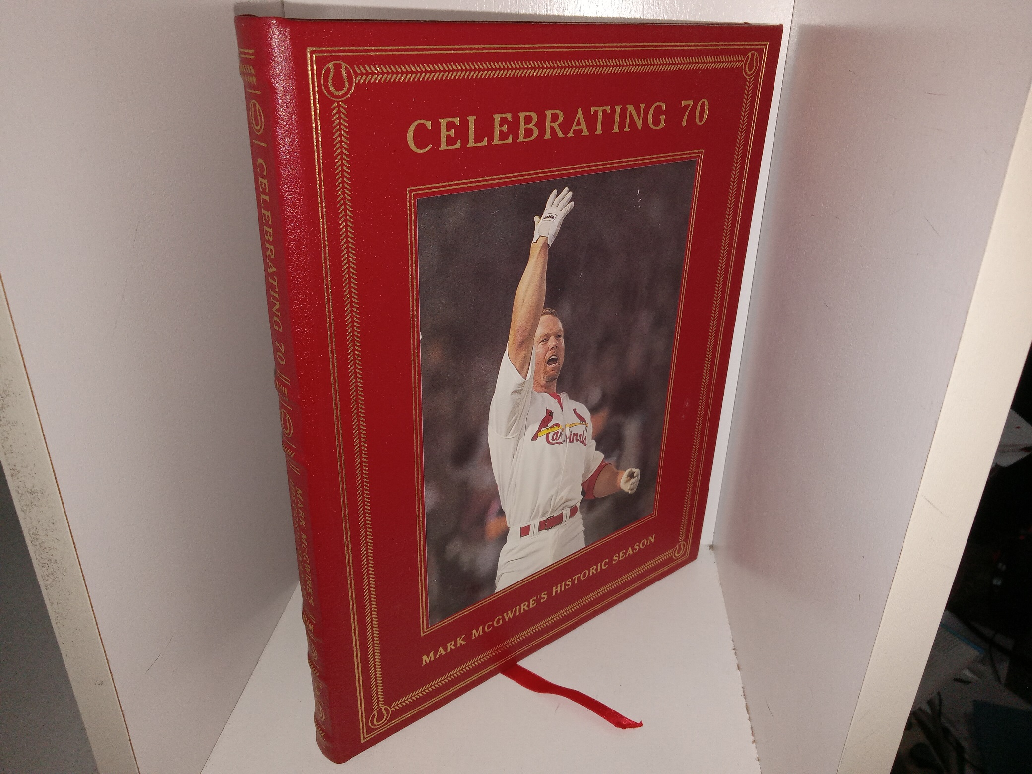 Celebrating 70: Mark McGwire’s Historic Season (Easton Press Leather) (1998) ~ by Bernie Miklasz, Ron Smith, Mike Eisenbath, and Dave Kindred