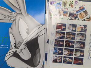 Book and $39.95 in New-Unused U.S. Stamps