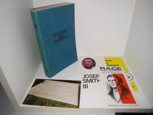 5 RLDS Items: RLDS Doctrine and Covenants, 3 RLDS Pamphlets (Race and Authority / Joseph Smith III / Book of Mormon), and a Postcard of the Graves of the Martyrs